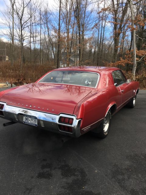 1972 Red metallic Oldsmobile Cutlass Coupe