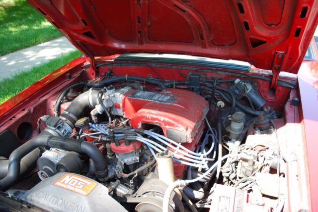 1987 red Ford Mustang Coupe