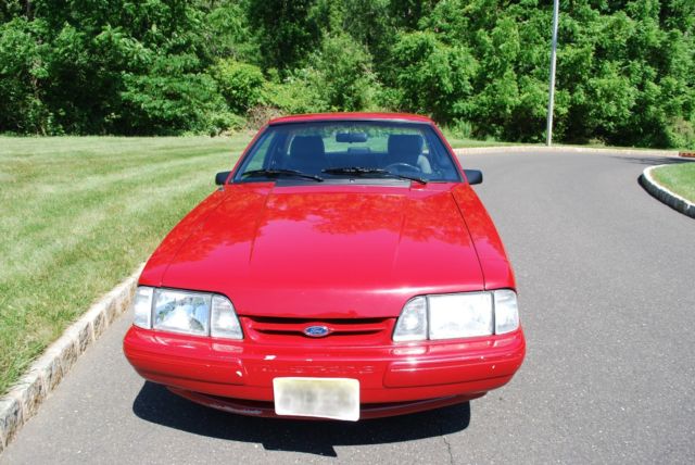1987 red Ford Mustang Coupe