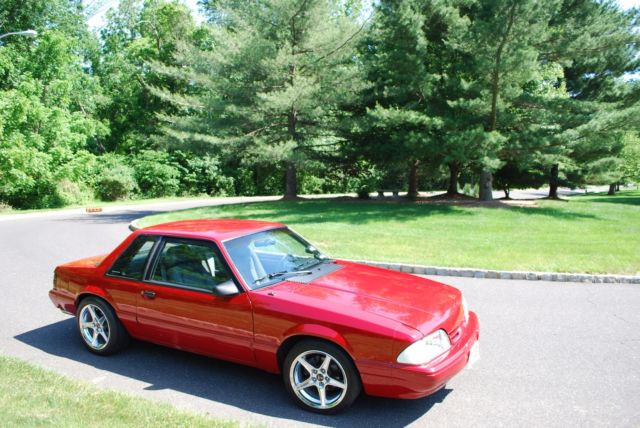 1987 red Ford Mustang Coupe
