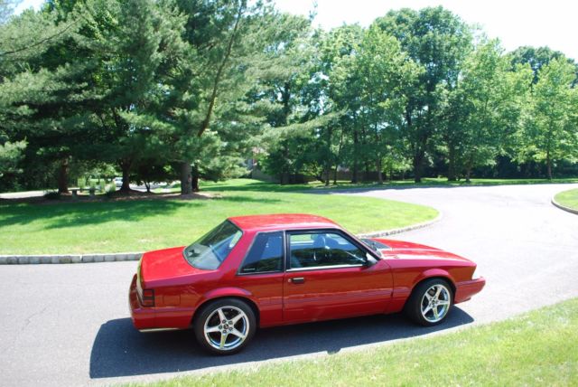 1987 red Ford Mustang Coupe
