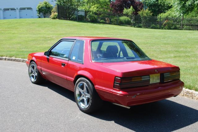 1987 red Ford Mustang Coupe