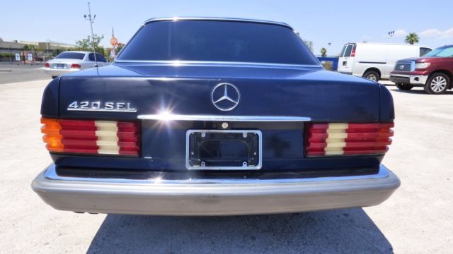 1986 Blue Mercedes-Benz 400-Series Sedan