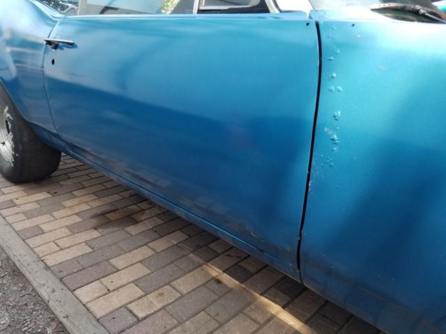 1968 blue Oldsmobile Cutlass Convertible