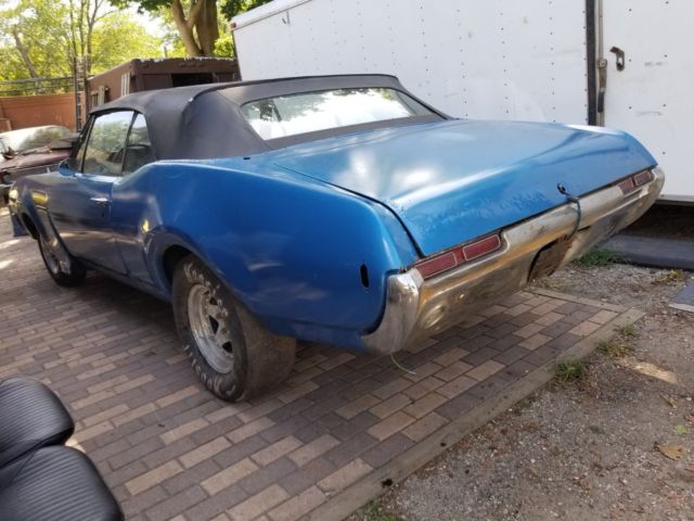 1968 blue Oldsmobile Cutlass Convertible