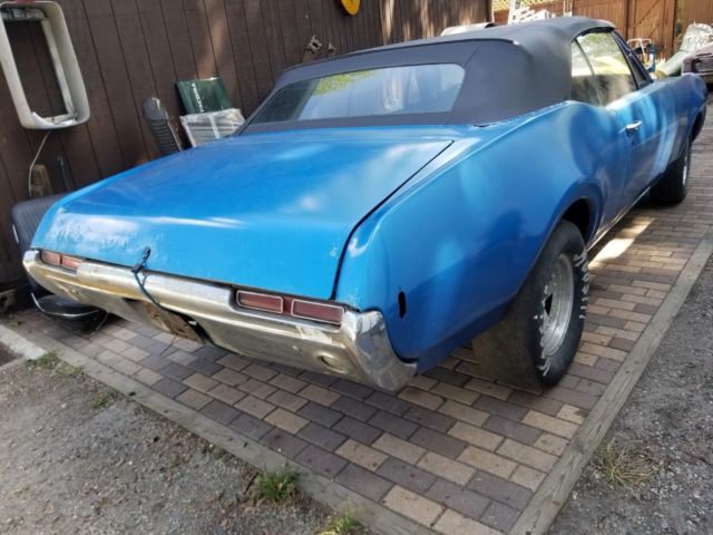 1968 blue Oldsmobile Cutlass Convertible