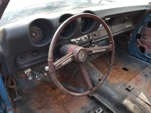 1968 blue Oldsmobile Cutlass Convertible