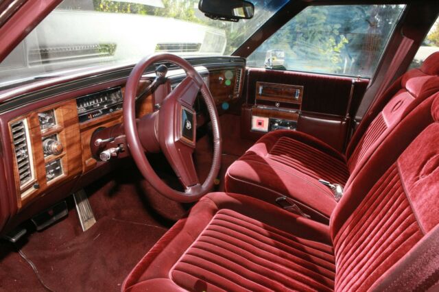 1987 Burgundy Cadillac Brougham 4 DOOR