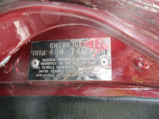 1974 maroon Chevrolet Corvette Coupe