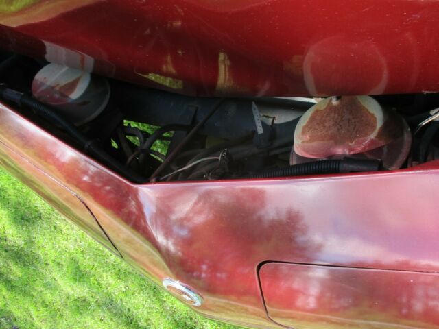 1974 maroon Chevrolet Corvette Coupe