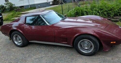 1974 maroon Chevrolet Corvette Coupe