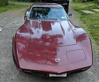 1974 maroon Chevrolet Corvette Coupe