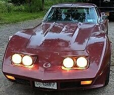 1974 maroon Chevrolet Corvette Coupe