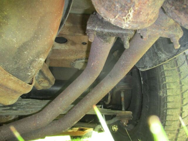 1974 maroon Chevrolet Corvette Coupe