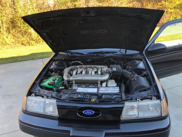 1989 Black Ford Taurus Coupe
