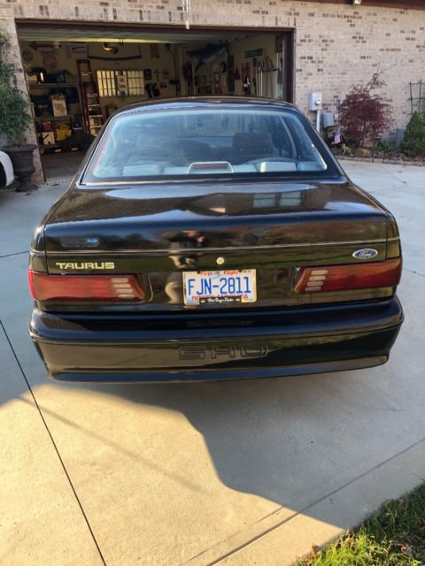 1989 Black Ford Taurus Coupe