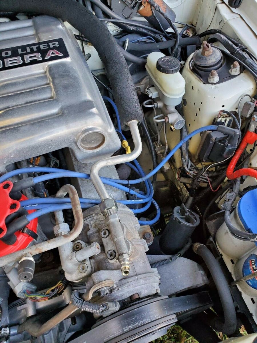 1990 White Ford Mustang Sedan