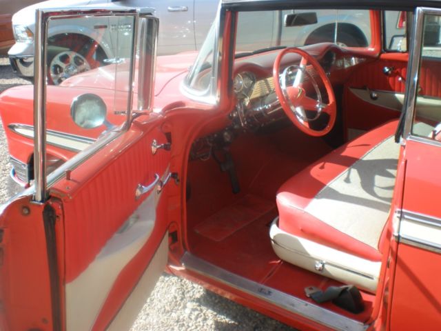 1956 red and white Chevrolet Bel Air/150/210 4 dr hard top