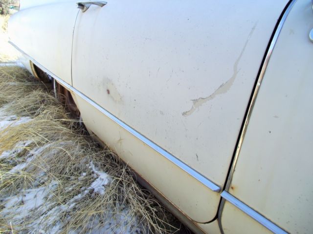 1960 White Cadillac DeVille Sedan