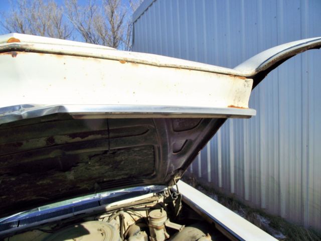 1960 White Cadillac DeVille Sedan