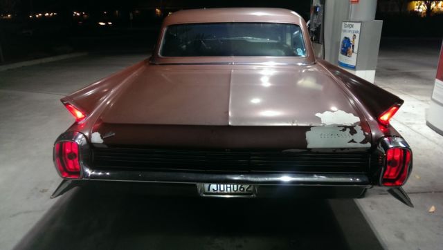 1962 Burgundy Cadillac Fleetwood Sedan