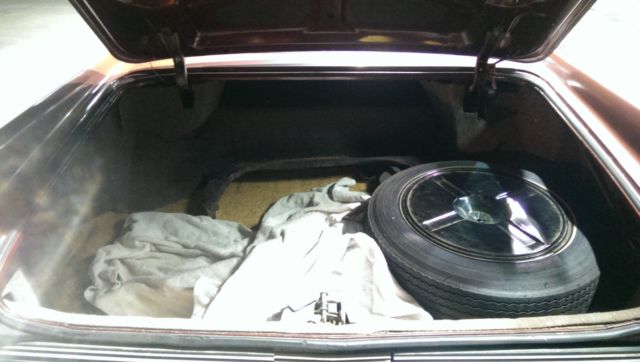 1962 Burgundy Cadillac Fleetwood Sedan