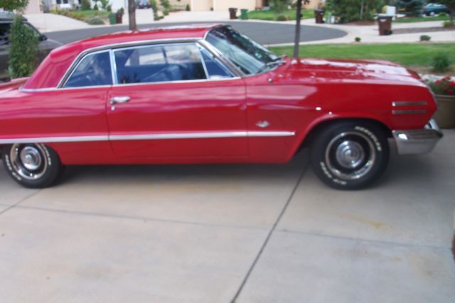 1963 red Chevrolet Impala Coupe