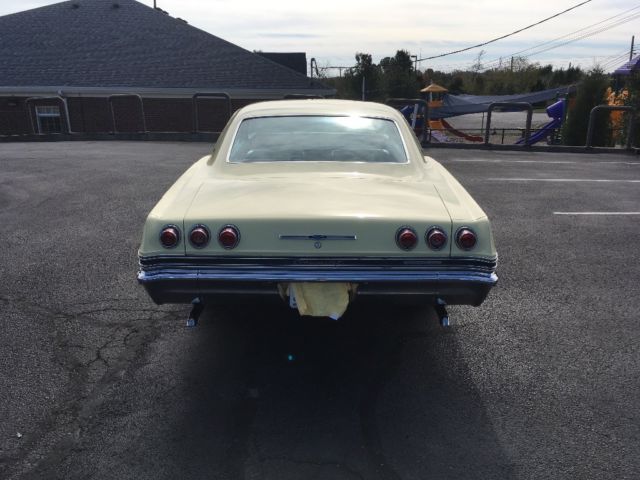 1965 Yellow Chevrolet Impala 2- Door hardtop