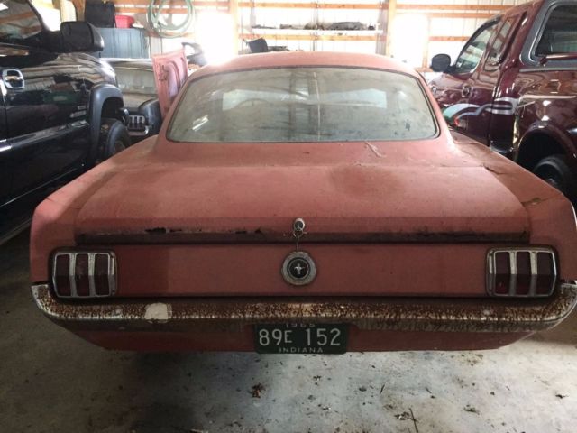 1965 vintage burgandy Ford Mustang Fastback