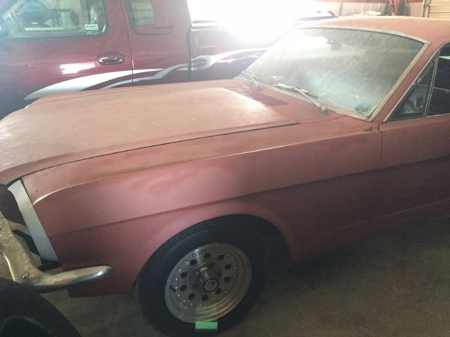 1965 vintage burgandy Ford Mustang Fastback