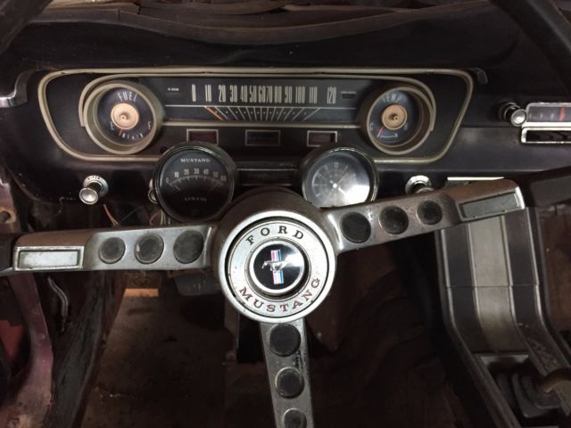 1965 vintage burgandy Ford Mustang Fastback