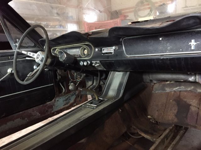 1965 vintage burgandy Ford Mustang Fastback