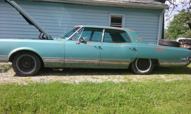 1965 blue Oldsmobile Ninety-Eight
