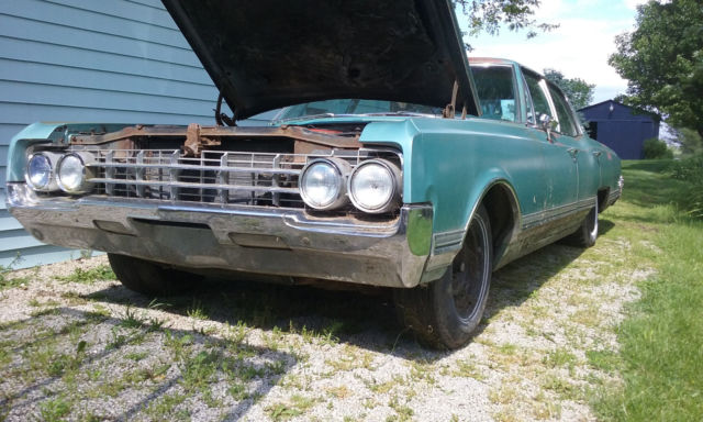 1965 blue Oldsmobile Ninety-Eight