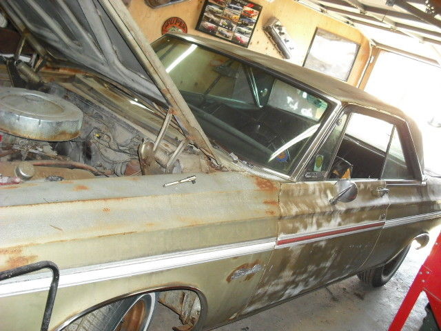 1965 ruby red Plymouth Satellite Sedan