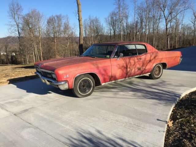1966 Red Chevrolet Caprice Coupe