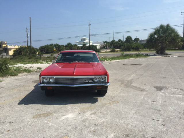 1966 red Chevrolet Capriceold
