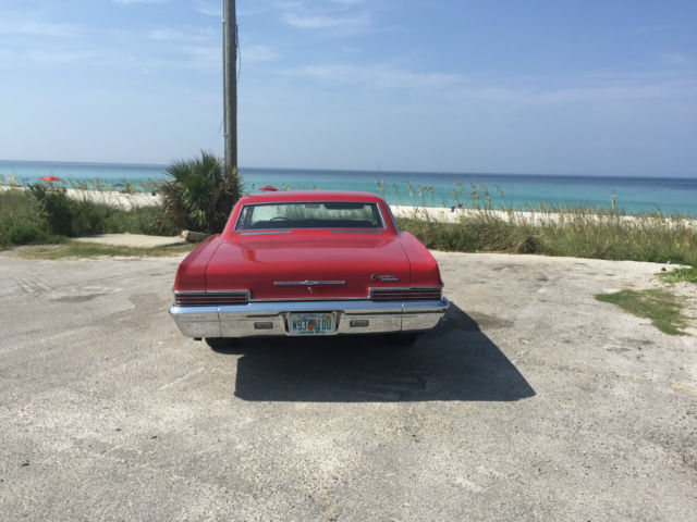 1966 red Chevrolet Capriceold