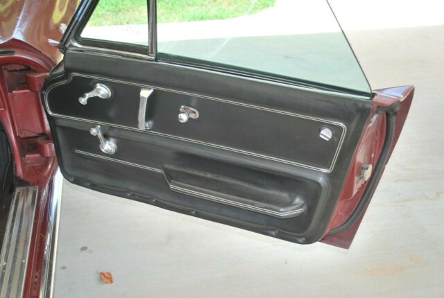 1966 maroon Chevrolet Corvette Convertible