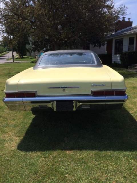 1966 yellow Chevrolet Impala Coupe