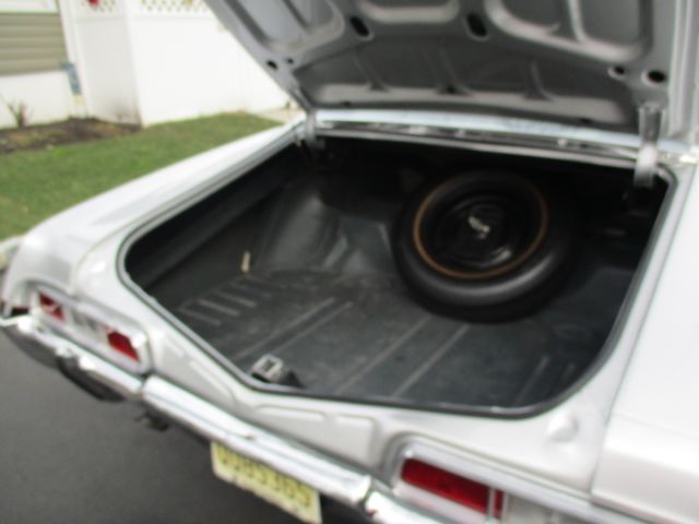 1967 Silver/Black with a double red pinstripe Chevrolet Impala Sport Coupe