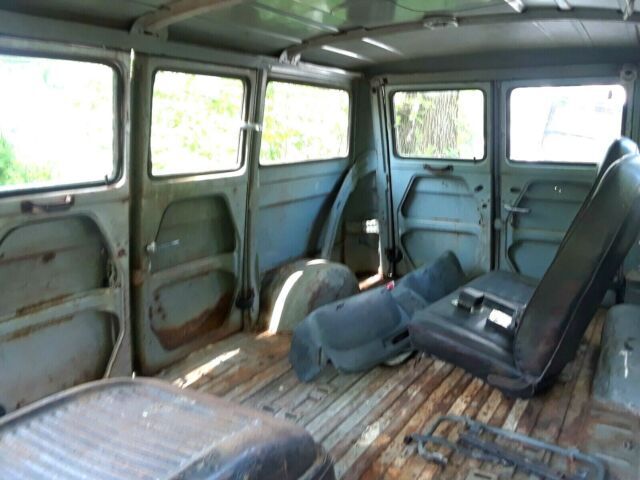 1964 Red and White Ford Falcon Multi window van