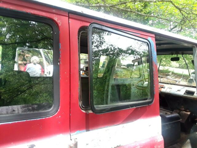 1964 Red and White Ford Falcon Multi window van