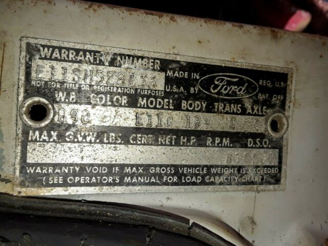 1964 Red and White Ford Falcon Multi window van