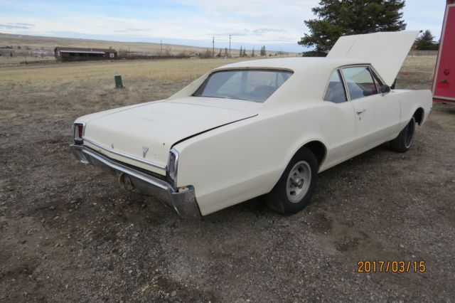 1967 Tan Oldsmobile Cutlass Coupe
