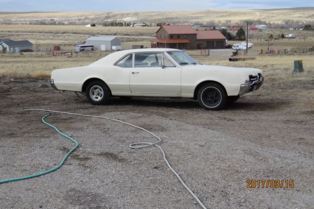 1967 Tan Oldsmobile Cutlass Coupe
