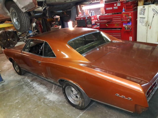 1967 bronze Pontiac Le Mans Coupe