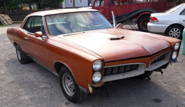 1967 bronze Pontiac Le Mans Coupe