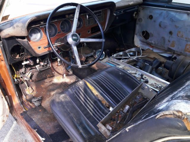 1967 bronze Pontiac Le Mans Coupe