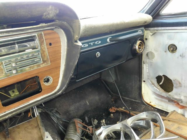 1967 bronze Pontiac Le Mans Coupe